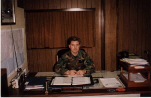 Kris Carlson seated at his desk - Keflavik NAS